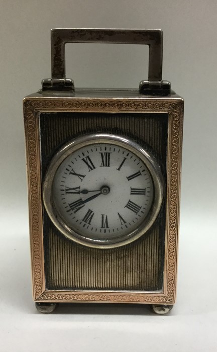 A good quality engine turned carriage clock with g