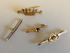 A group of four gold gem set brooches. Approx. 8 g