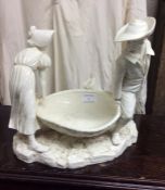 A good Antique porcelain group on rocky base.