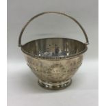 A circular silver sugar bowl with bead decoration