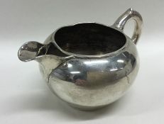 A Dutch silver cream jug on reeded base. Approx. 8