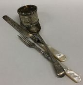A heavy silver napkin ring together with a christe