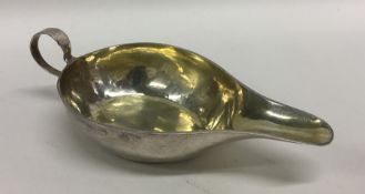 A small Antique silver sauce boat with gilt interi