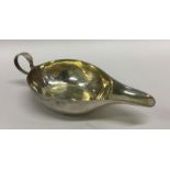 A small Antique silver sauce boat with gilt interi