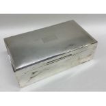 A rectangular silver engine turned cigarette box w