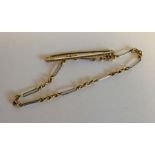 A small gold bracelet together with a brooch. Appr