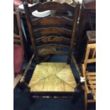 A cane seated slap back chair.