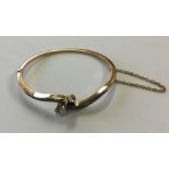 A good sapphire and diamond bangle in claw mount a