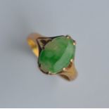 A gold jade signet ring in claw mount. Approx. 2.5