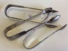 A group of three pairs of silver sugar tongs. Appr