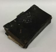 A rare early silver mounted book decorated with le