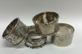 A group of four silver engraved napkin rings. Appr