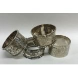 A group of four silver engraved napkin rings. Appr