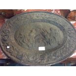 A cast iron oval plaque.