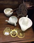 A lemon strainer, horse brasses, etc.