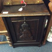 An oak carved coal box.