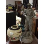 A spelter figure and an Oriental vase.