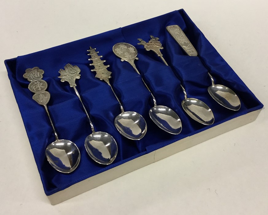 A set of six silver Chinese coffee spoons containe