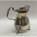 A Georgian style silver helmet shaped cream jug. S