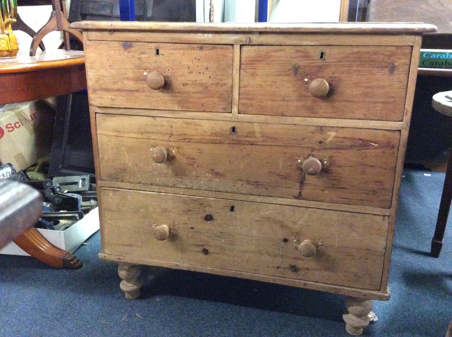 A pine chest of four drawers.
