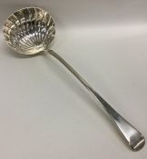 A heavy silver OE ladle with shell bowl. Approx. 2