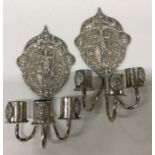 A good pair of Dutch silver wall sconces embossed