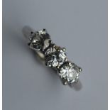 A good diamond three stone ring in platinum claw m