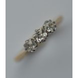 A small diamond three stone ring in 18 carat claw