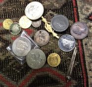 A collection of old silver and other coins.