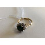 A diamond and tourmaline cluster ring in two colou