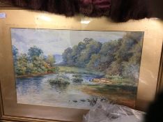 A framed and glazed picture of a river scene.