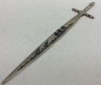 A Continental silver and enamelled letter opener i