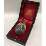 STUART DEVLIN: An unusual cased silver egg of typi