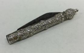 A Continental silver embossed folding knife decora