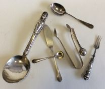 Silver mounted cruet spoons, tongs, etc. Approx. 7