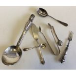 Silver mounted cruet spoons, tongs, etc. Approx. 7