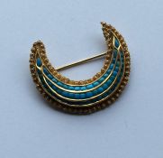 A high carat gold Eastern turquoise crescent brooc