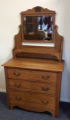 A satinwood three drawer dressing chest. Est. £25