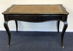 A Continental ebony and brass inlaid desk with lea