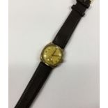 A gent's 9 carat Vertex wristwatch on leather stra