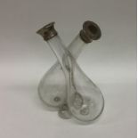 A glass oil and vinegar bottle with twisted stem a
