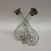 A glass oil and vinegar bottle with twisted stem a