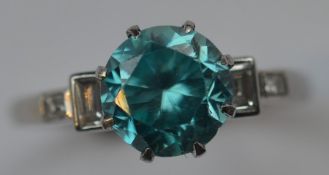 A zircon and diamond five stone ring in claw mount