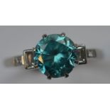 A zircon and diamond five stone ring in claw mount