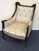 A Continental tapestry back armchair with scroll a