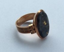 An Antique rose gold oval mourning ring with agate