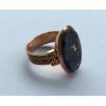 An Antique rose gold oval mourning ring with agate