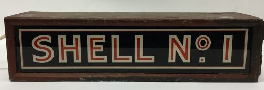 A metal and glass light box inscribed "Shell No 1"