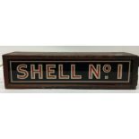 A metal and glass light box inscribed "Shell No 1"