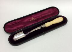 A good cased silver stilton scoop with carved ivor